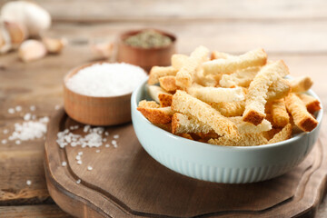 Delicious hard chucks in bowl on wooden table, closeup