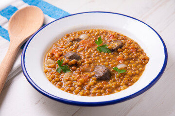 Traditional spanish tapas lentejas con chorizo y morcilla