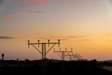 Runway signals during sunset.