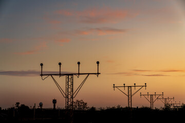 Runway signals during sunset.