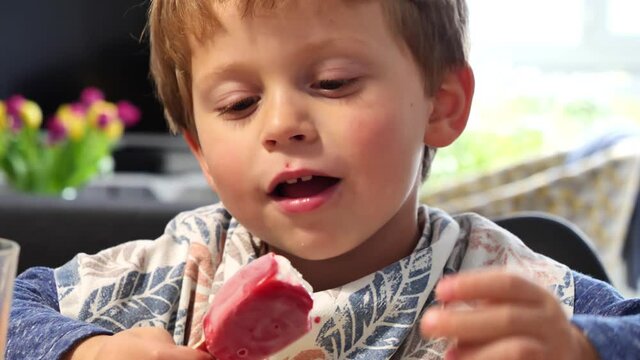 Child eating icecream, close up