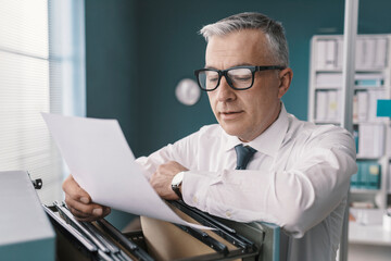 Businessman searching for files and documents