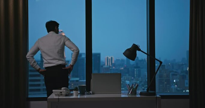 worried asian businessman in office