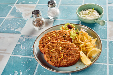 Fish patties with fries and sauce