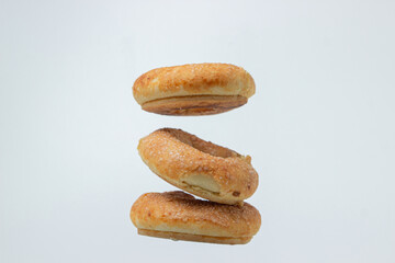 Fototapeta na wymiar Sweet donuts on a white background. Isolated sweetness on a light background. Sweet bagels