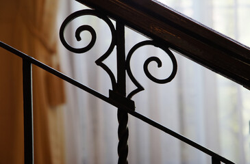 Patterned handrail on the indoor stairs of the house