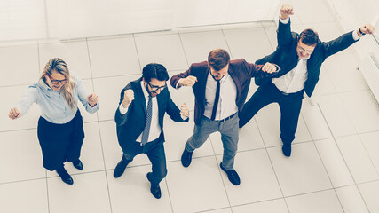 Fototapeta na wymiar top view. dancing group of business people celebrating together.