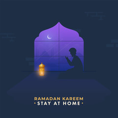 Silhouette Muslim Man Praying With Lit Lantern On Blue Night View Background On The Occasion Of Ramadan Kareem, Stay At Home To Prevent From Covid-19.