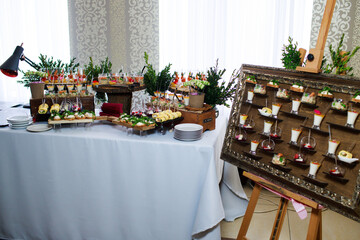 Catering service. Snacks for guests on the table.