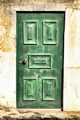 Old and colorful wooden door with iron details
