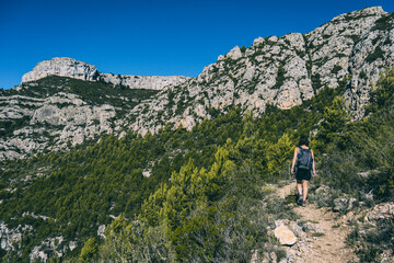 woman hiking on a mountain path in catalonia