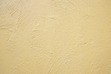 Textured background. decorative plaster walls, external decoration of facade. texture of yellow