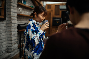 Japanese couple drinking coffee at home