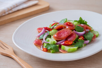 Spicy chinese pork sausage salad on plate, Thai food