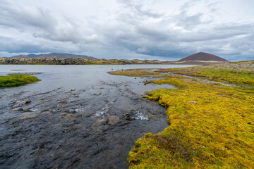 Wetlands of southern Iceland on a cloudy day. Volcanic landscape getting wet during springtime.