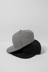 Set of blank monochrome gray and black baseball cap isolated over white background