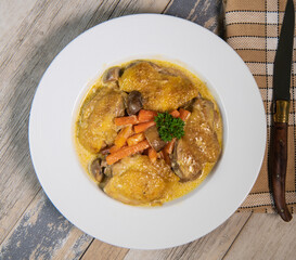 Recipe for chicken fricassee in white wine, with a carrot and mushroom planter, High quality photo