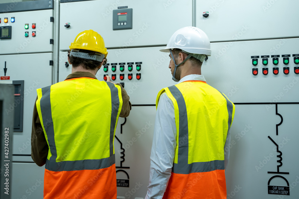 Aufkleber technical worker with engineer working and checking in control room power plant at industry factory.