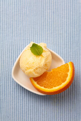 Homemade scoop of orange sorbet from above