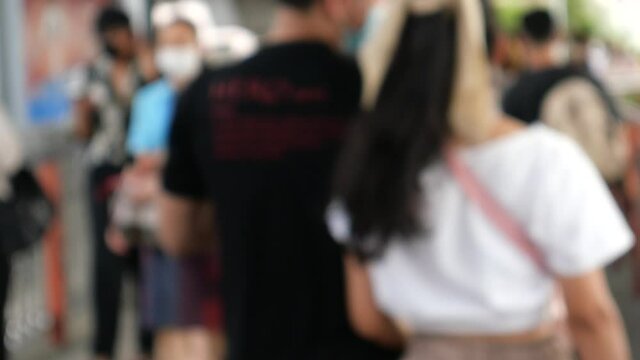 Asians walking on skywalk