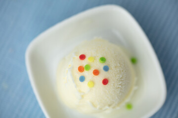 Simple scoop of frozen yogurt or vanilla ice cream from above