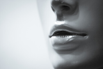 Portrait of female lips of a mannequin