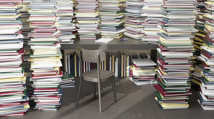 Fototapeta premium desk surrounded by many books stacked all around