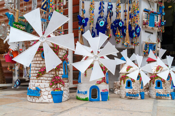 Turkey, Bodrum.Ceramic greek mill souvenirs on the shop window.