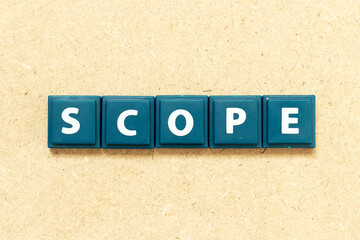 Tile alphabet letter in word scope on wood background