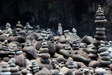 pebbles balancing next to a beach