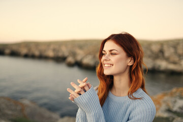 pretty woman in blue sweater enjoy nature fresh air freedom
