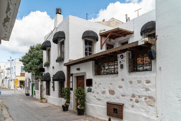 Beautiful Streets of old Marmaris. Narrow streets with stairs among the houses with white brick, green plants and flowers in the old town of resort of in Turkey