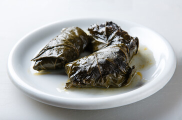 Dolma - stuffed grape leaves with rice and meat. Traditional Caucasian, Greek, Armenian and Georgian cuisine. Also known as tolma or sarma