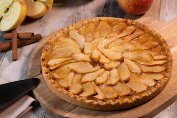Delicious apple pie on a wooden table, from above. High quality photo
