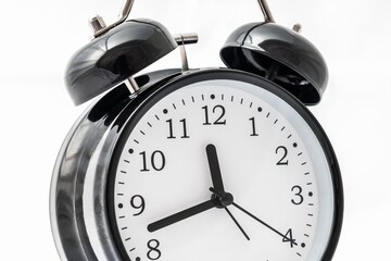 Retro alarm clock with double bell isolated on white