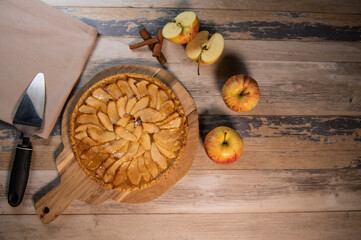 Delicious apple pie on a wooden table, from above. High quality photo