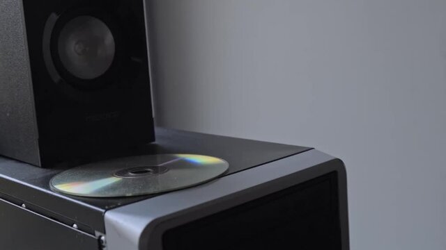 Close up of stationary computer unit details. Stock footage. System unit with a sound speaker and a cd disk on its upper panel.