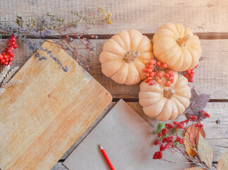 Autumn background, fallen leaves, fruits, vegetables on rustic wooden table. Seasonal set, aged vintage paper, copy space. Thanksgiving food, healthy and fresh, top view, flat lay.
