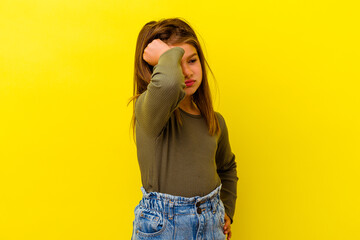 Little caucasian girl isolated on yellow background celebrating a victory, passion and enthusiasm,...