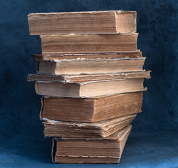 a stack of old books on the table