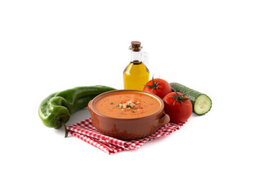 Gazpacho soup in crock pot and ingredients isolated on white background