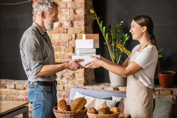 Man and woman in profile with boxes