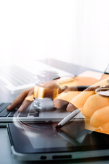 Business and lawyers discussing contract papers with brass scale on desk in office. Law, legal services, advice, justice and law concept picture with film grain effect