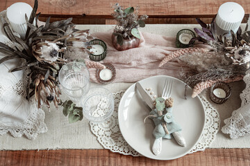 Festive table setting in vintage style with dry flowers.