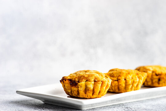 Savoury meat pies with cheese on a plate