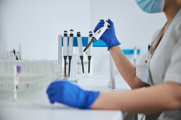 Biochemist getting ready for conducting a blood test