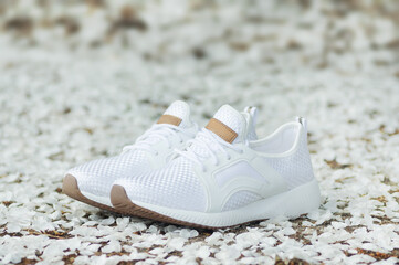 White sneakers on a flower background