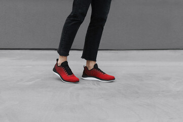 Red mens sneakers on a feet