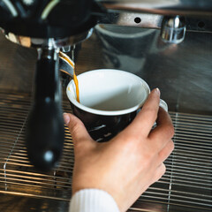 pouring coffee into cup