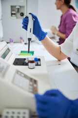 Experienced lab technician preparing for conducting a blood test